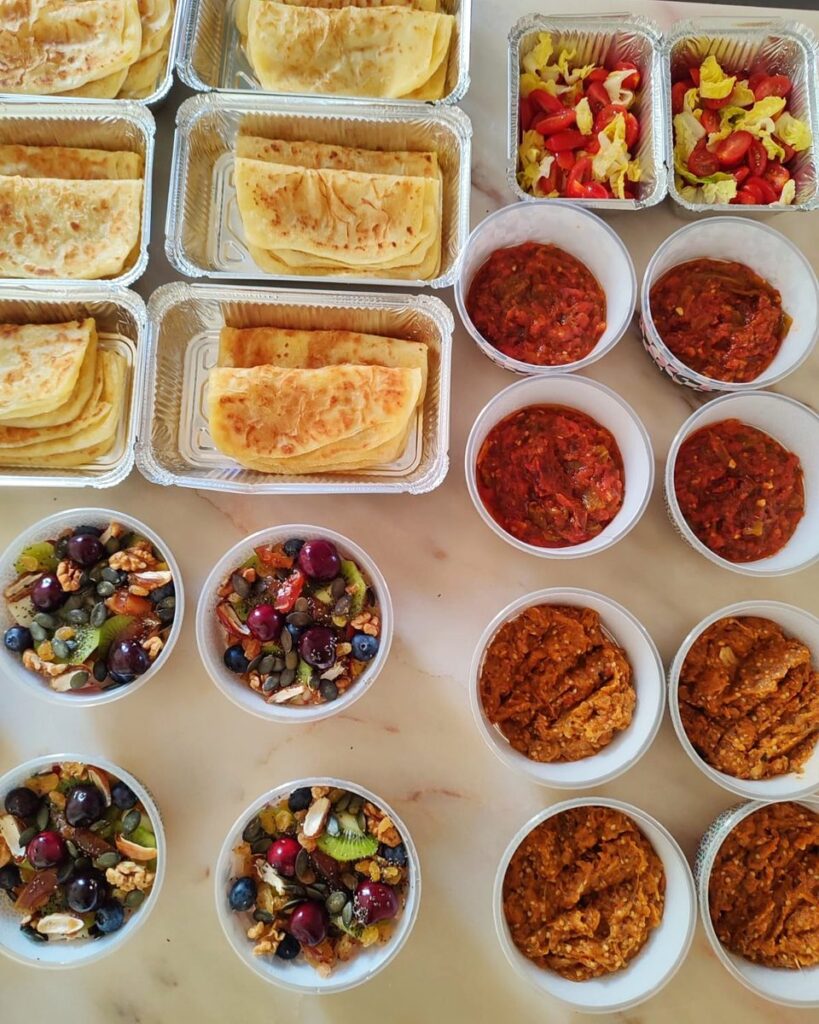 Assorted vegan breakfast dishes packed for delivery in Marrakech