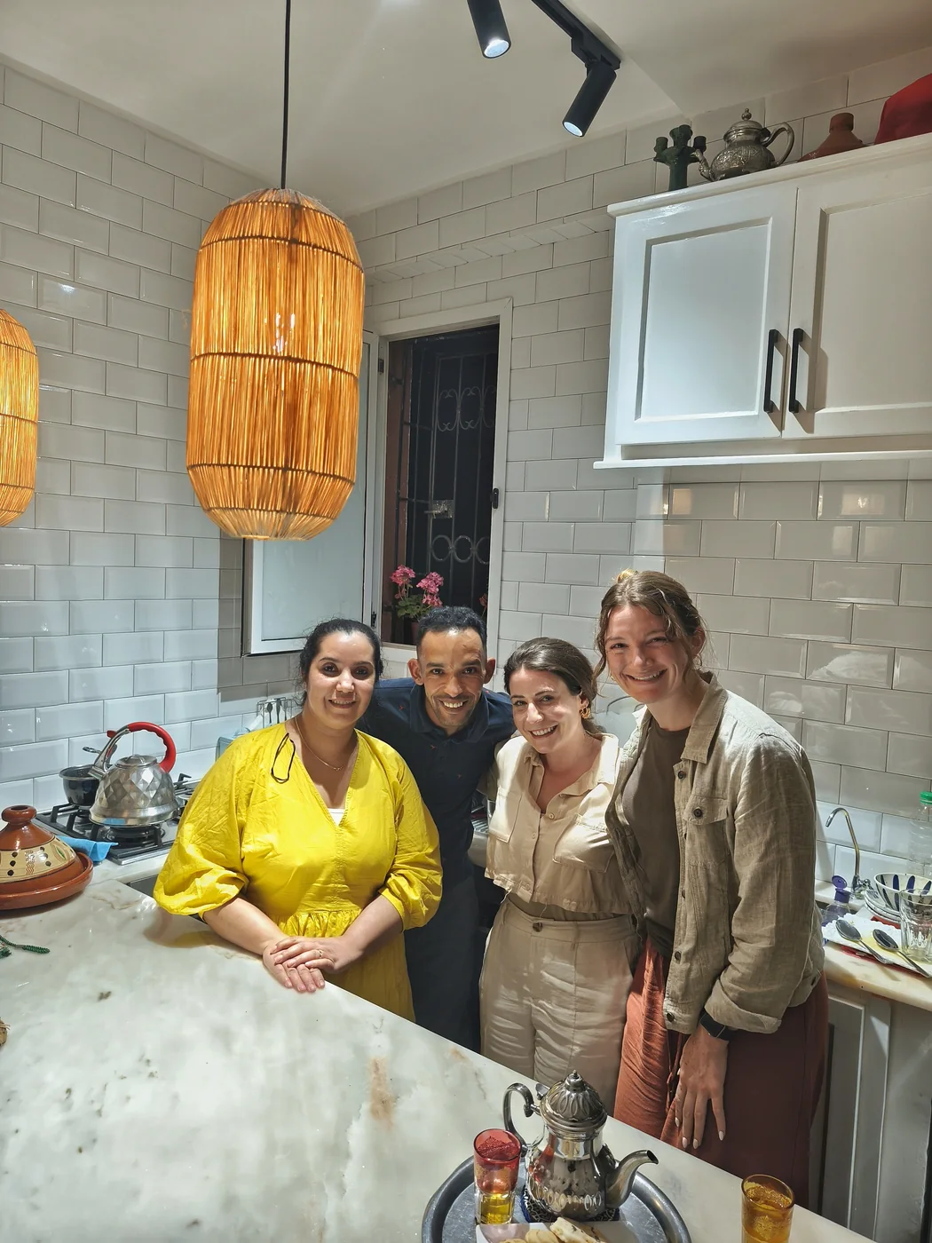 Dounia and Hassane welcoming travelers in their Marrakech family kitchen